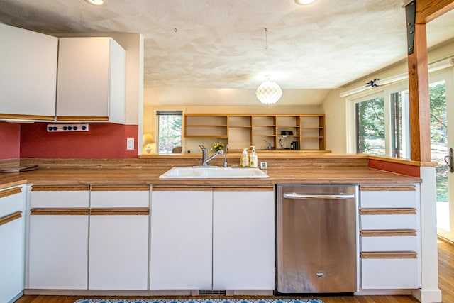 34 Ridge Rd, Jackson, NH 03846 - kitchen featuring stainless steel dishwasher, a sink, white cabinetry, wooden counters, and plenty of natural light