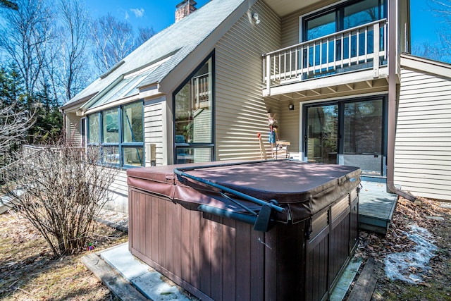 34 Ridge Rd, Jackson, NH 03846 - rear view of property with a hot tub, a balcony, and a chimney