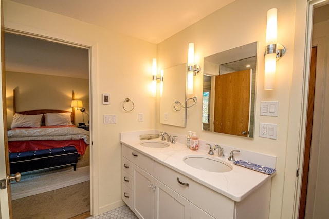 34 Ridge Rd, Jackson, NH 03846 - full bathroom featuring ensuite bath, double vanity, tile patterned flooring, and baseboards