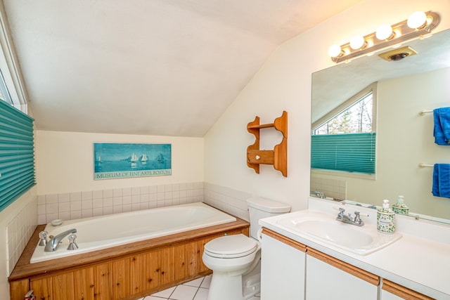 34 Ridge Rd, Jackson, NH 03846 - bathroom featuring vaulted ceiling, a garden tub, vanity, toilet, and tile patterned flooring