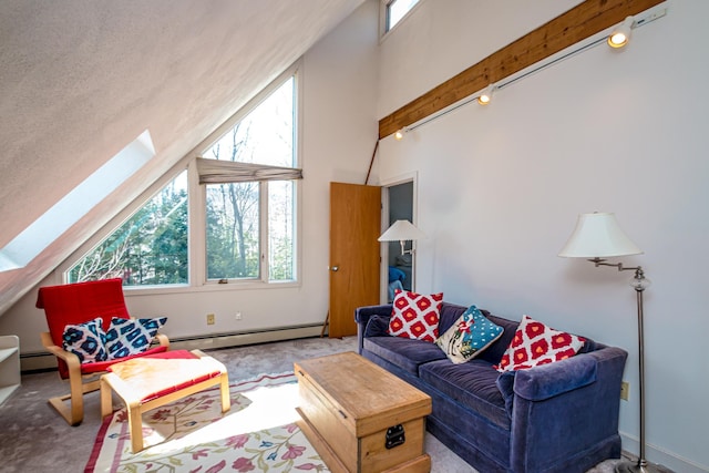 34 Ridge Rd, Jackson, NH 03846 - living area featuring a baseboard radiator, a skylight, carpet, plenty of natural light, and high vaulted ceiling