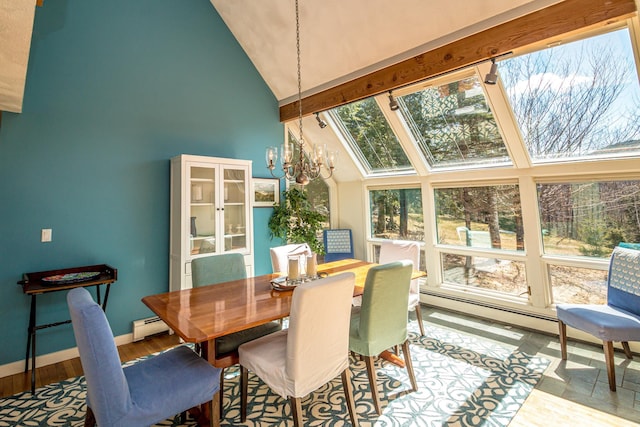 34 Ridge Rd, Jackson, NH 03846 - dining area with high vaulted ceiling, a chandelier, wood finished floors, a baseboard radiator, and baseboards