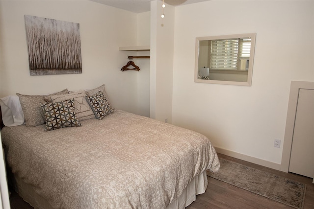 30 Pond St Unit 11, Ludlow, VT 05149 - bedroom featuring dark wood finished floors and baseboards