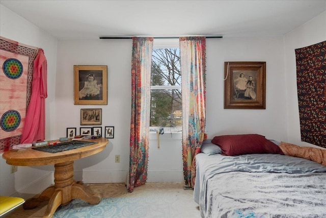 bedroom featuring baseboards