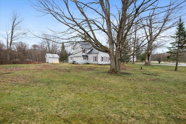 view of yard featuring an outbuilding and a shed