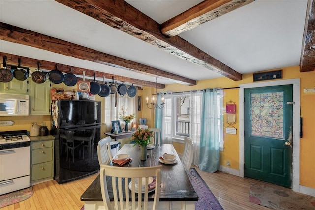 interior space with baseboards, beamed ceiling, light wood finished floors, and an inviting chandelier