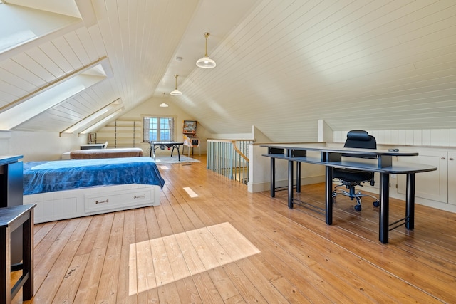 bedroom with hardwood / wood-style flooring and vaulted ceiling