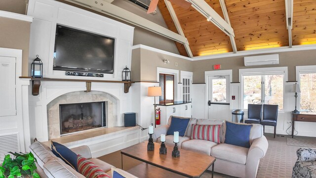 living area featuring a high end fireplace, wooden ceiling, beam ceiling, a wall mounted AC, and high vaulted ceiling
