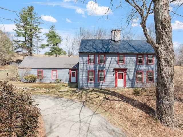colonial home with a chimney