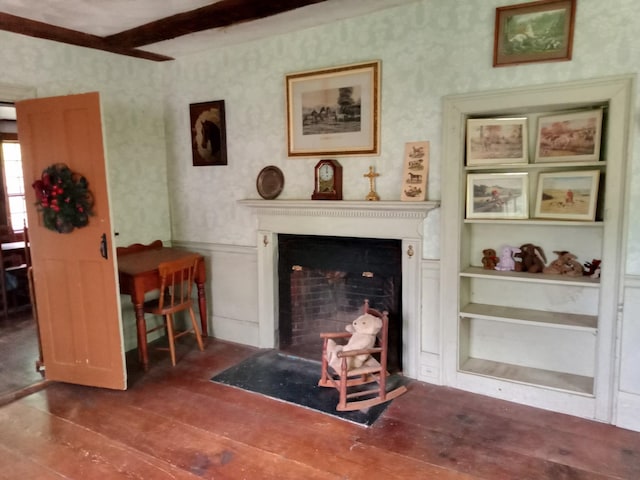 113 Conversevillle Rd, Rindge, NH 03461 - living room with wood-type flooring, wallpapered walls, a fireplace with flush hearth, wainscoting, and beam ceiling