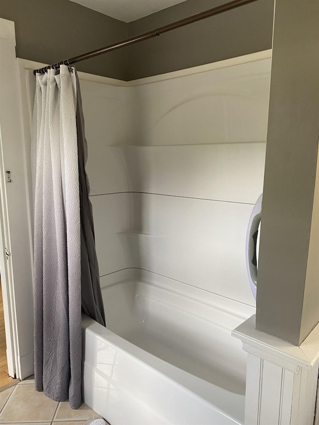 bathroom with shower / bathtub combination with curtain