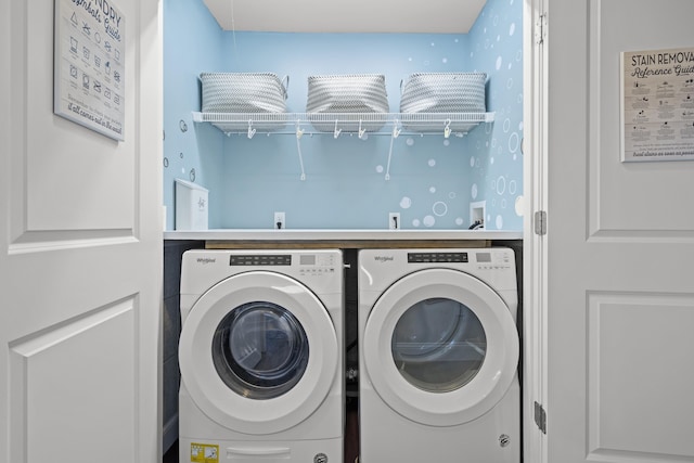 laundry room featuring washing machine and clothes dryer and laundry area