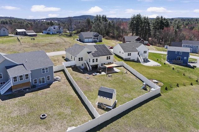 drone / aerial view featuring a view of trees