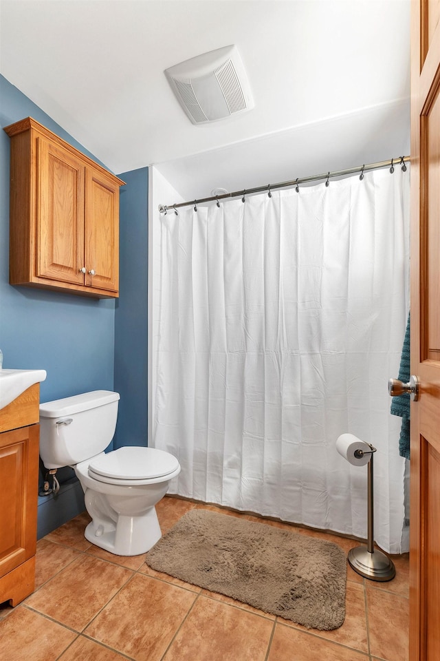 full bathroom with lofted ceiling, tile patterned floors, visible vents, and toilet