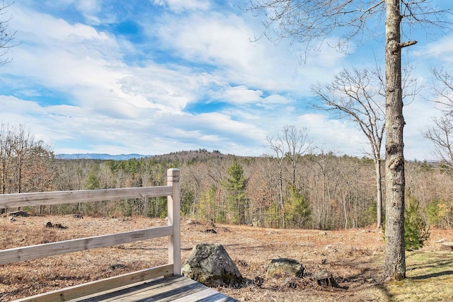 view of mountain feature with a forest view