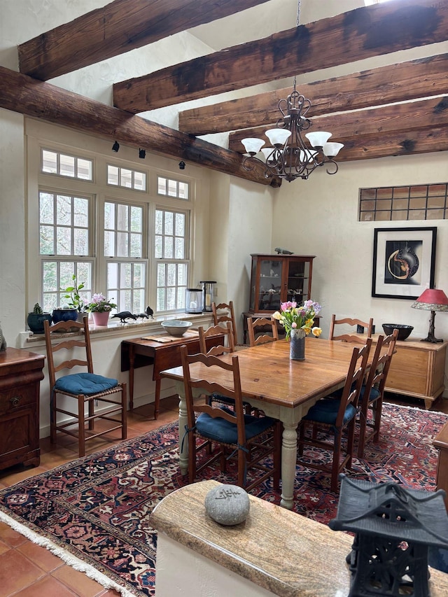 tiled dining area featuring beam ceiling and a notable chandelier