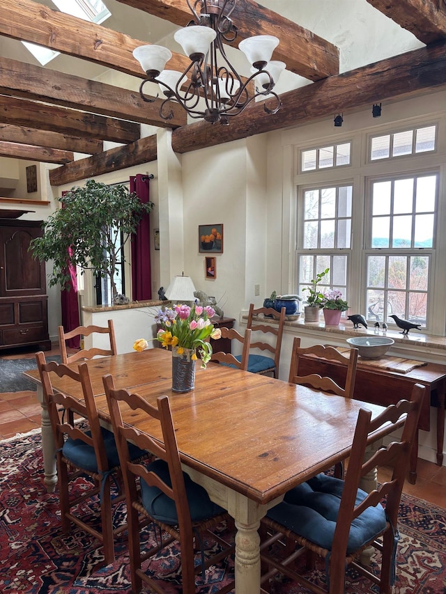 dining room featuring tile patterned flooring, beam ceiling, and a notable chandelier