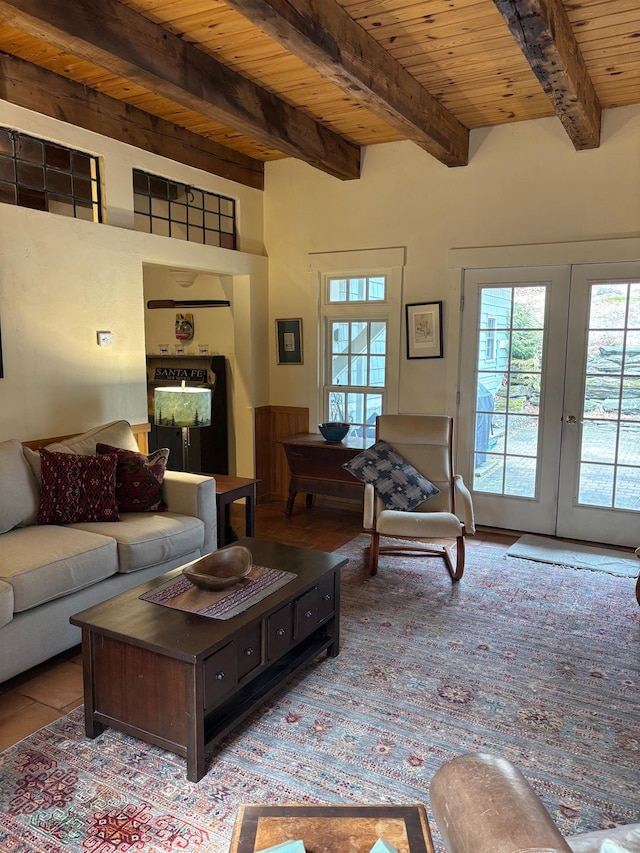 living area with beamed ceiling, wood ceiling, and french doors