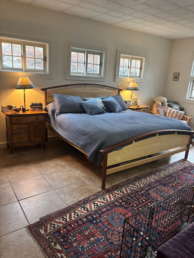 bedroom featuring light tile patterned flooring