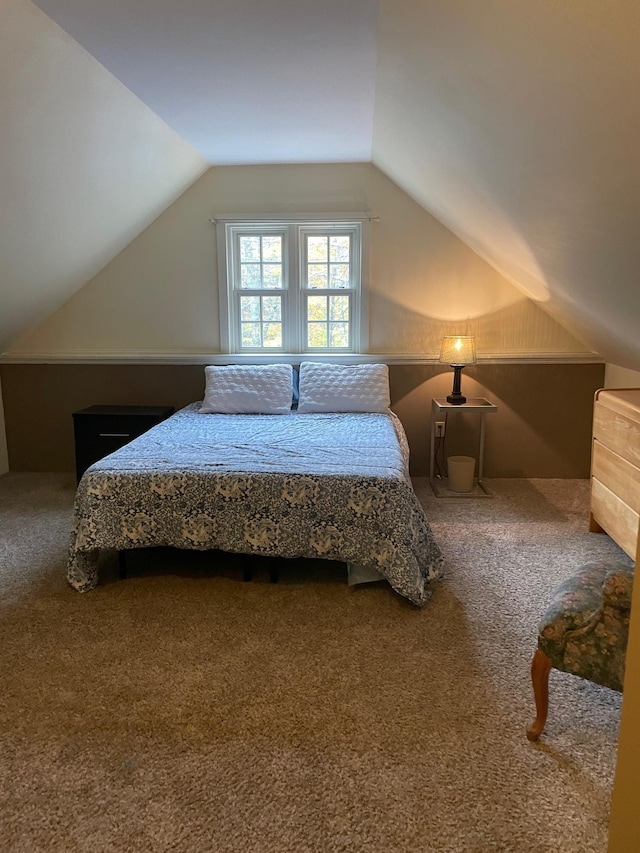 carpeted bedroom with vaulted ceiling