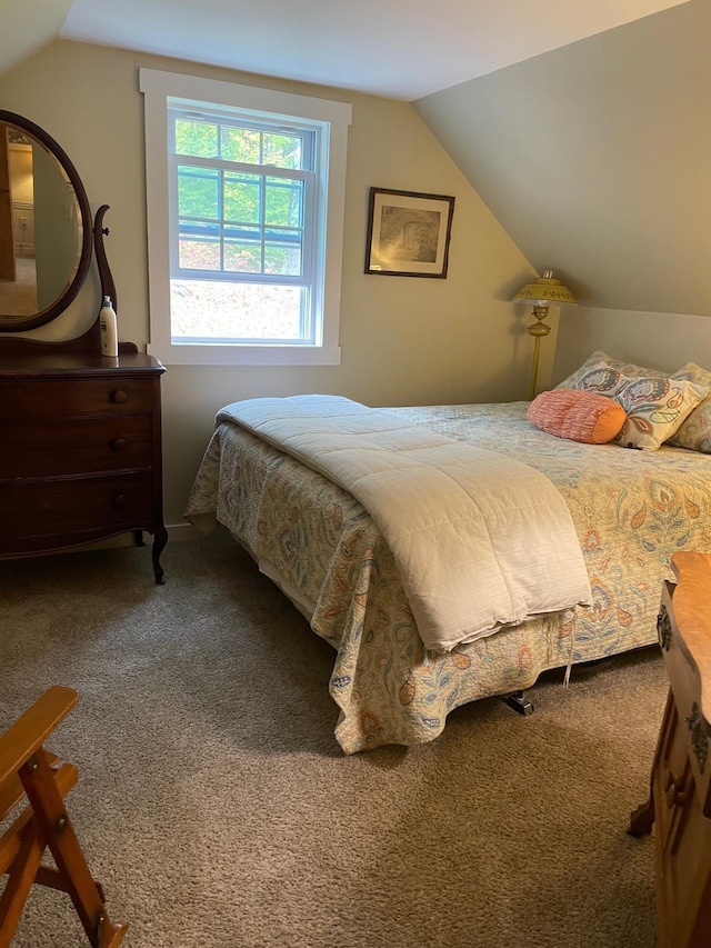 carpeted bedroom featuring lofted ceiling