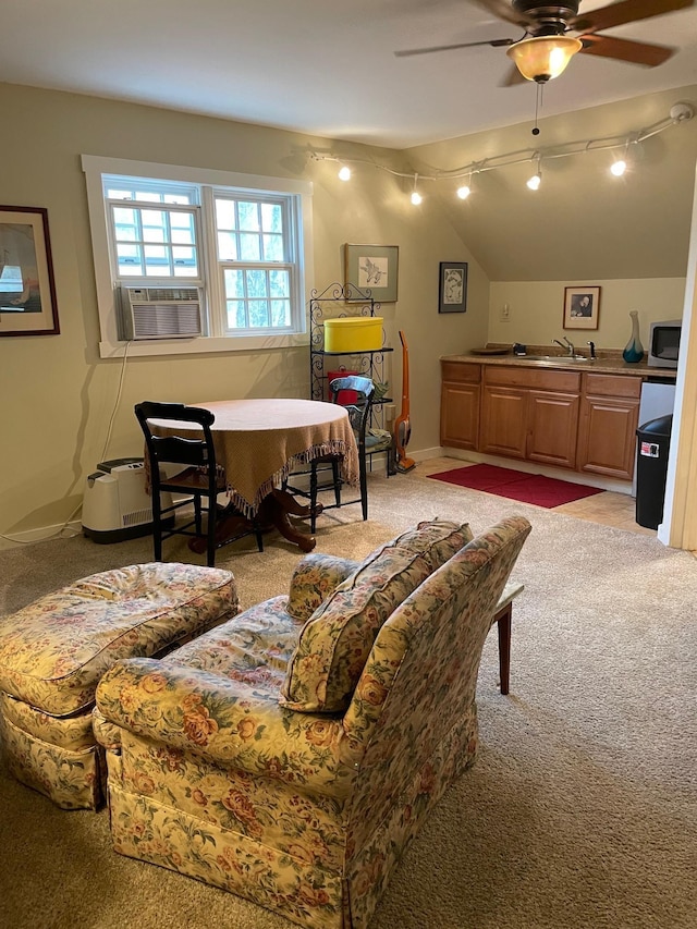 living area featuring vaulted ceiling, ceiling fan, cooling unit, and light carpet