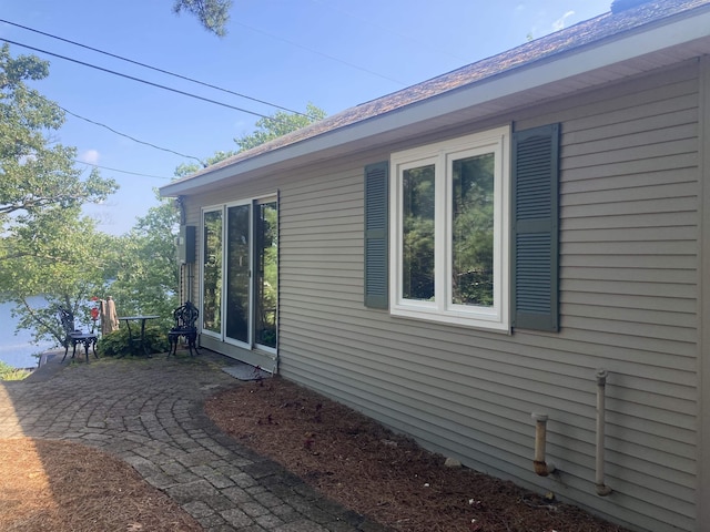 view of side of property featuring a patio