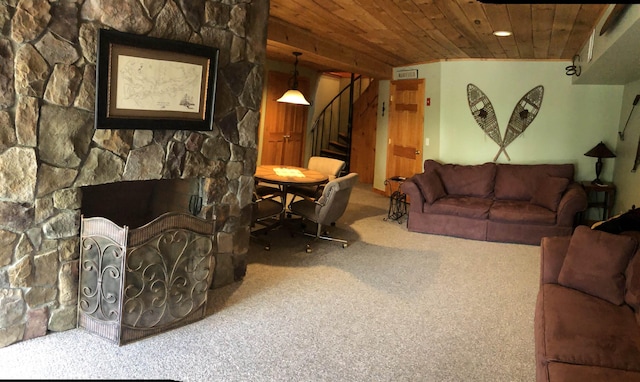living room featuring carpet, recessed lighting, stairway, wooden ceiling, and a fireplace