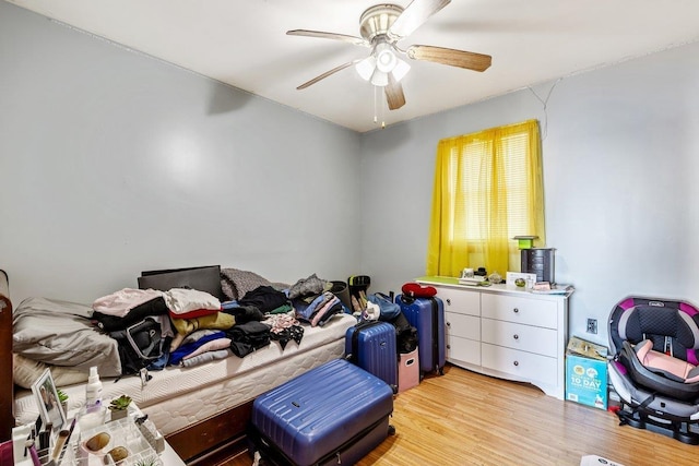 bedroom featuring light wood-style flooring and ceiling fan