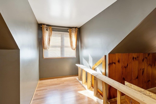 additional living space featuring wood finished floors