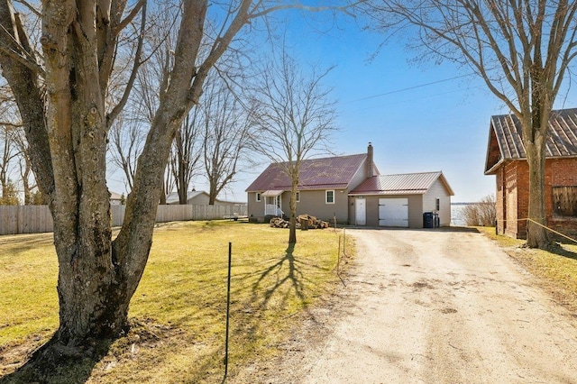 ranch-style home featuring central air condition unit, driveway, fence, and a front yard