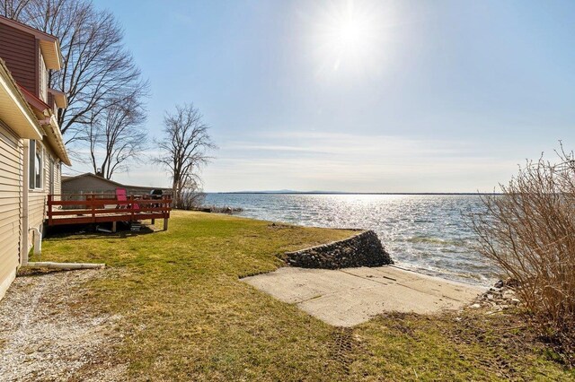 view of yard featuring a deck with water view