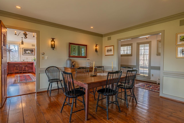 3360 Dorset W Rd, Dorset, VT 05251 - dining room featuring hardwood / wood-style floors, visible vents, ornamental molding, and wainscoting