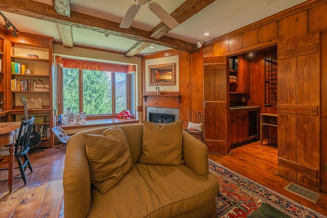 3360 Dorset W Rd, Dorset, VT 05251 - living area with hardwood / wood-style floors, a premium fireplace, and visible vents