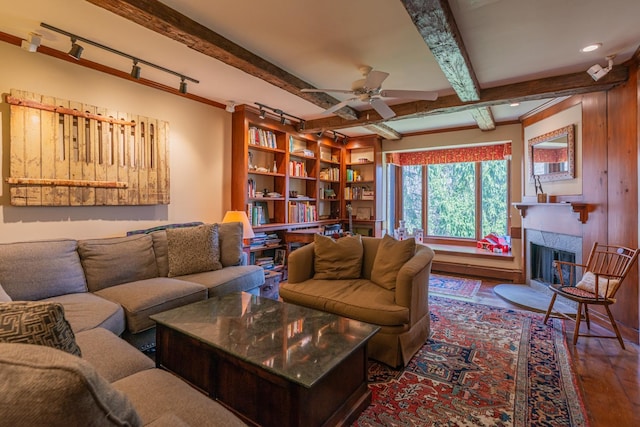 3360 Dorset W Rd, Dorset, VT 05251 - living room featuring beam ceiling, track lighting, wood finished floors, ceiling fan, and a tile fireplace