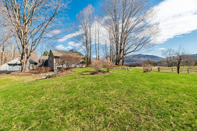 3360 Dorset W Rd, Dorset, VT 05251 - view of yard featuring a detached garage, fence, and a mountain view