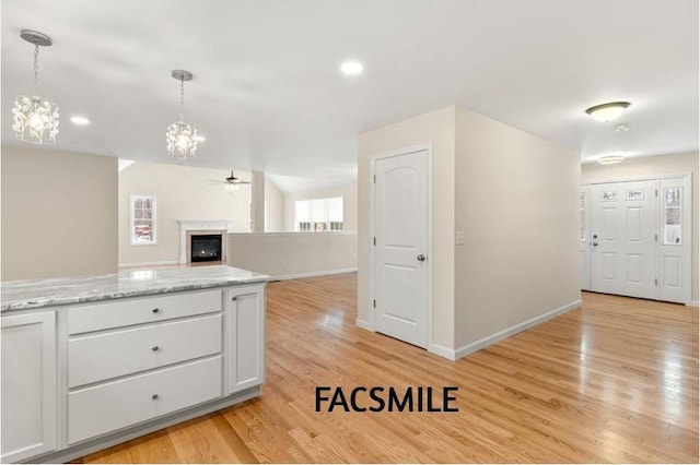 102 Laurel Rd Unit 30, Hooksett, NH 03106 - kitchen with a ceiling fan, baseboards, light wood finished floors, hanging light fixtures, and recessed lighting