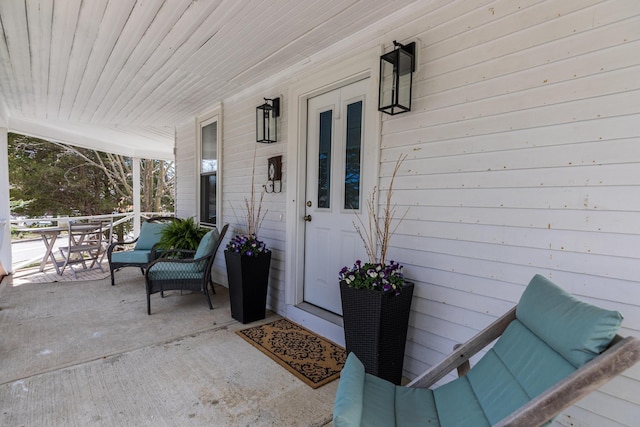 doorway to property featuring a porch