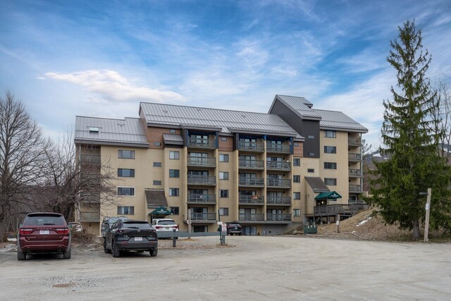 135 E Mountain Rd Unit 1F7, Killington, VT 05751 - view of property with uncovered parking