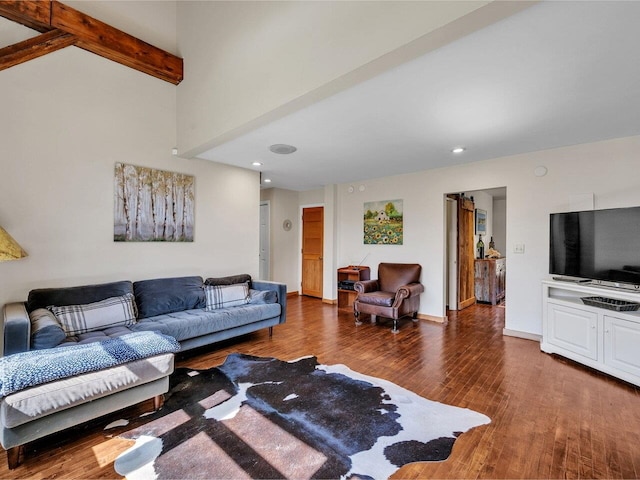 living room featuring beamed ceiling, baseboards, wood finished floors, and recessed lighting