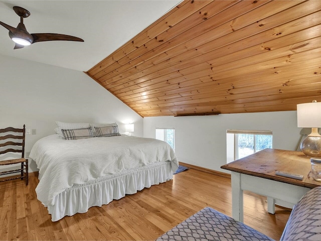 bedroom with vaulted ceiling, baseboards, light wood-style floors, and ceiling fan
