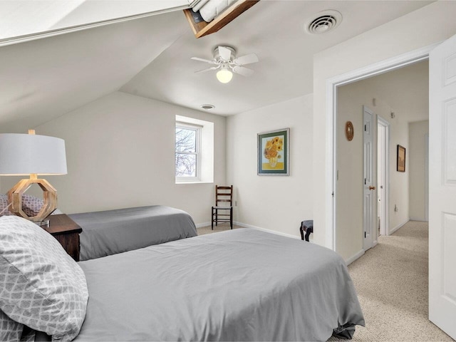 bedroom featuring lofted ceiling, visible vents, light carpet, baseboards, and ceiling fan
