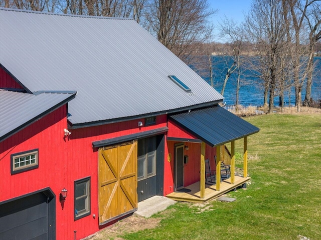 view of outbuilding featuring a water view