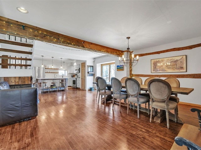 dining space with dark wood-style floors, baseboards, an inviting chandelier, recessed lighting, and beamed ceiling