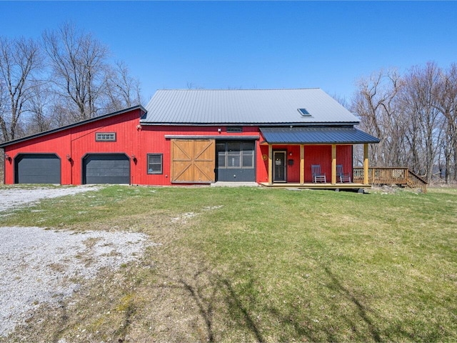 exterior space with driveway and an outbuilding