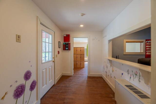 interior space with dark wood finished floors, baseboards, and recessed lighting