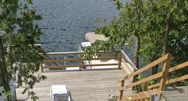 wooden deck with a water view