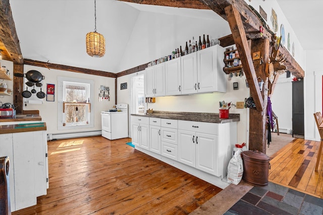 kitchen with a baseboard heating unit, white electric range oven, white cabinetry, and dark countertops