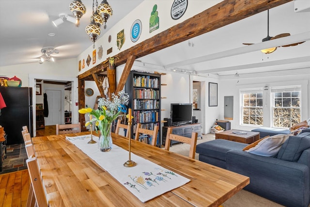 living room with a ceiling fan, wood finished floors, vaulted ceiling with beams, and electric panel