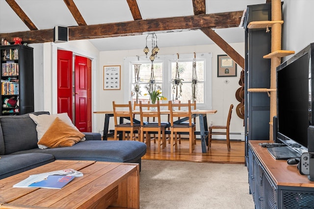 living room featuring lofted ceiling with beams and light carpet